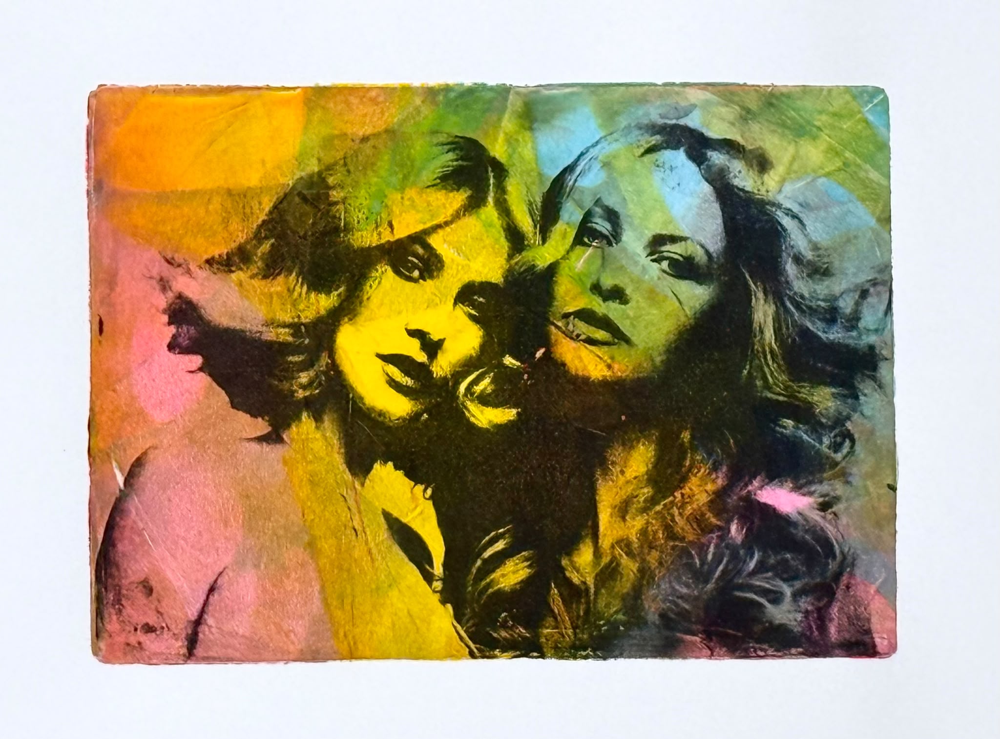 Colourful Gelli plate print featuring two women's faces in yellow, pink, green and blue